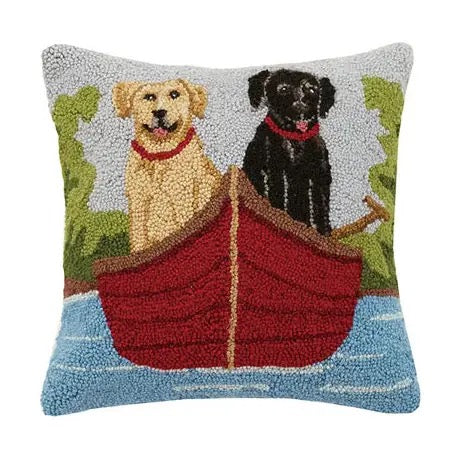 Decorative pillow with two dogs in a boat on a lake