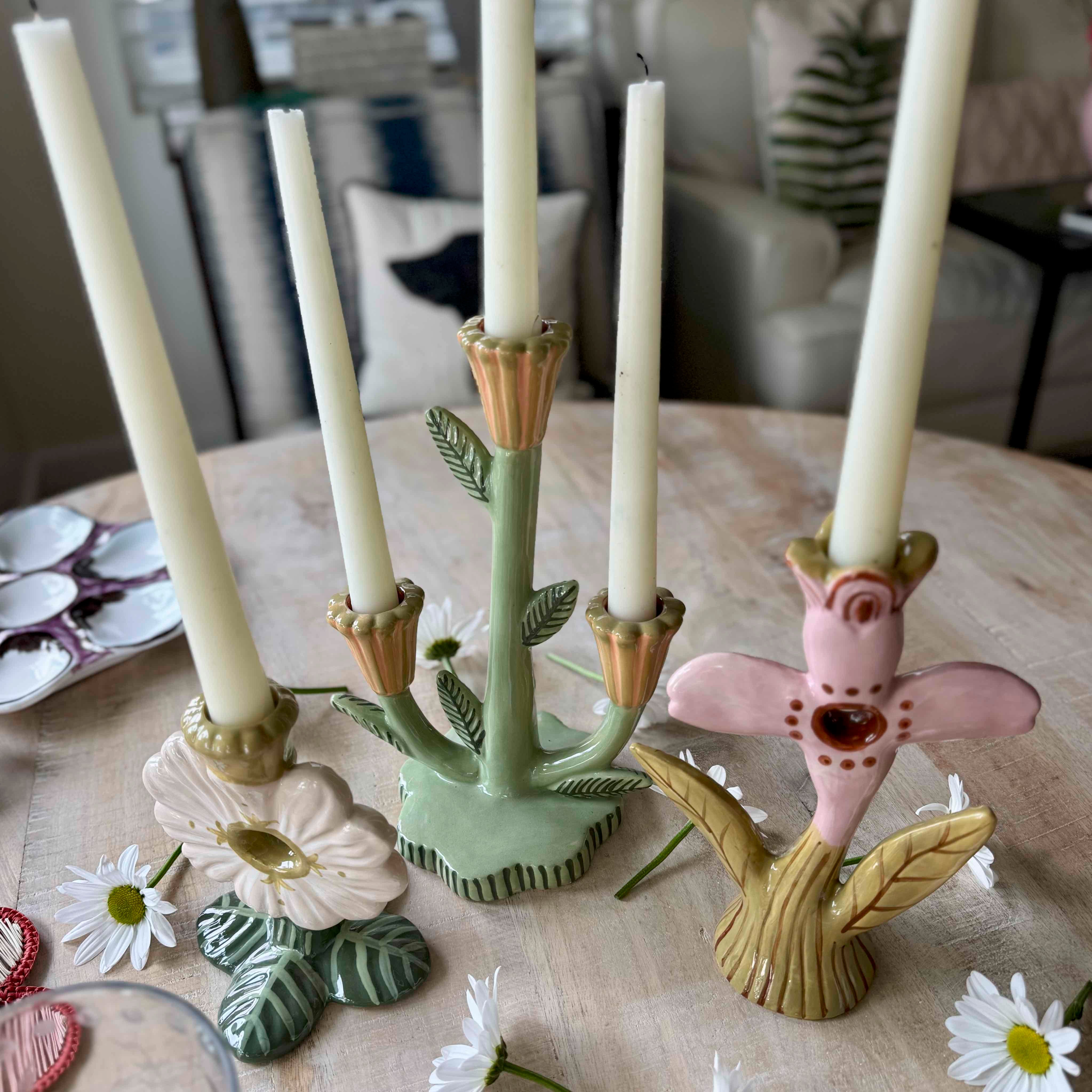 Decorative candle holders with candles on a table
