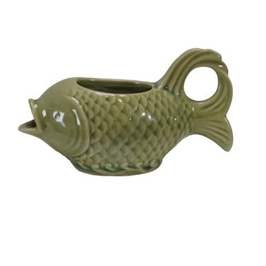Ceramic fish-shaped planter on a white background