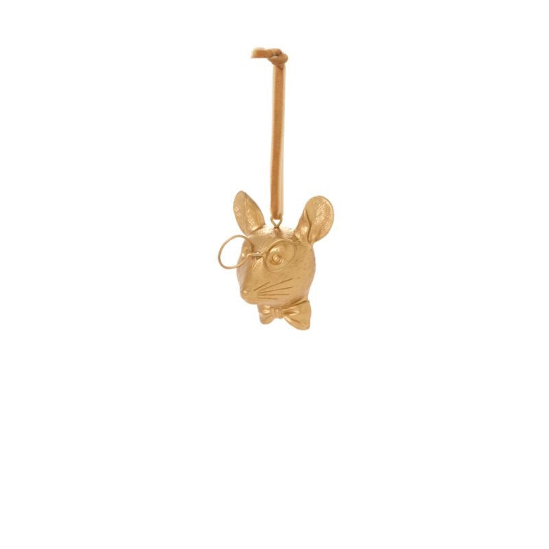 Gold dog-shaped ornament on a white background