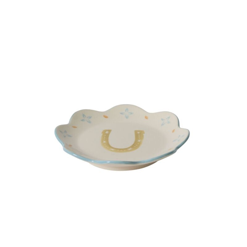 Decorative plate with a horseshoe design on a white background