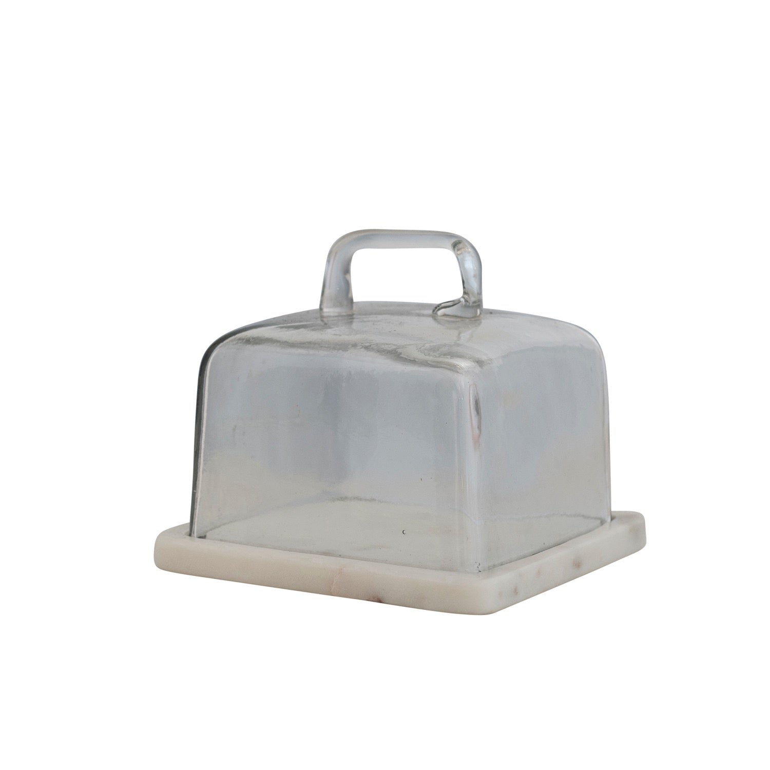 Clear glass cake stand with beige base on a white background