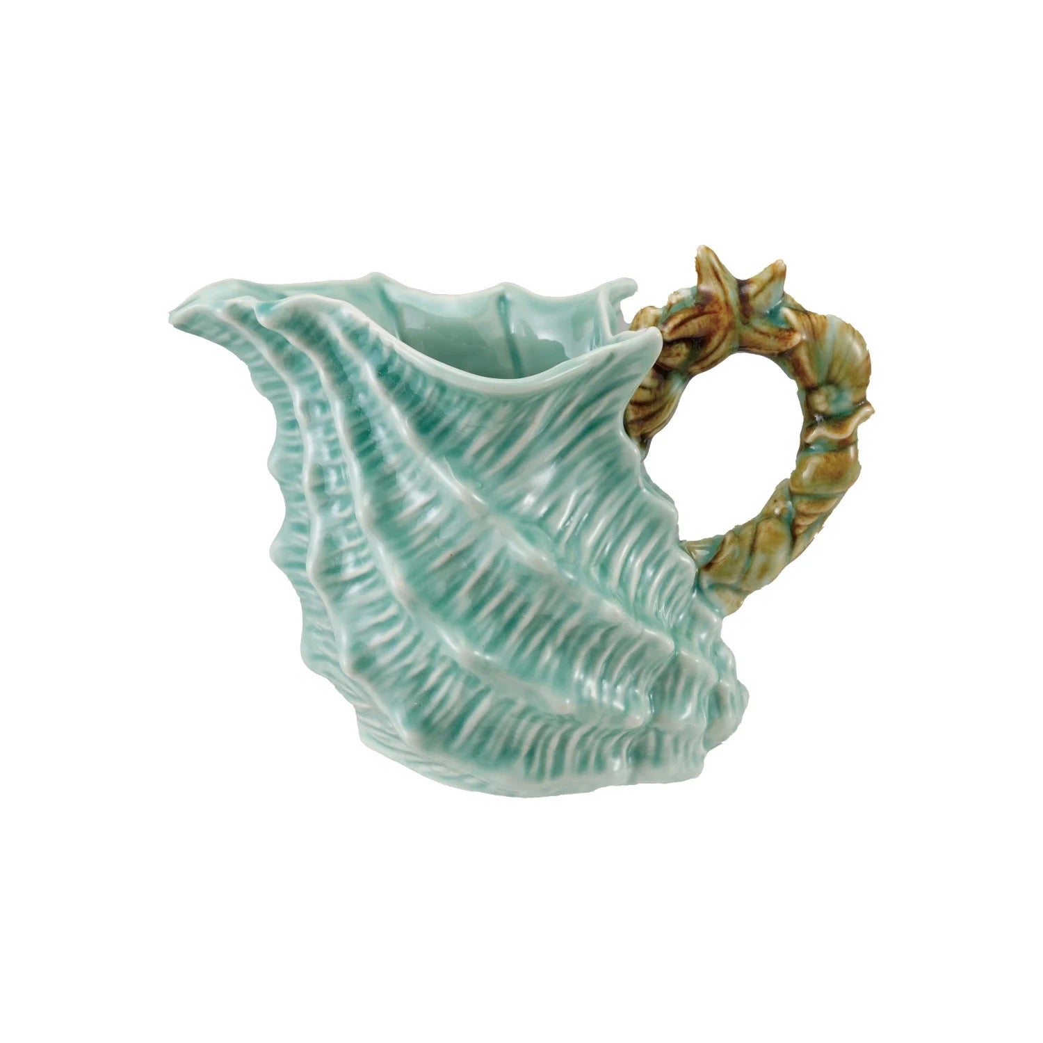 Ceramic shell-shaped pitcher with a handle on a white background