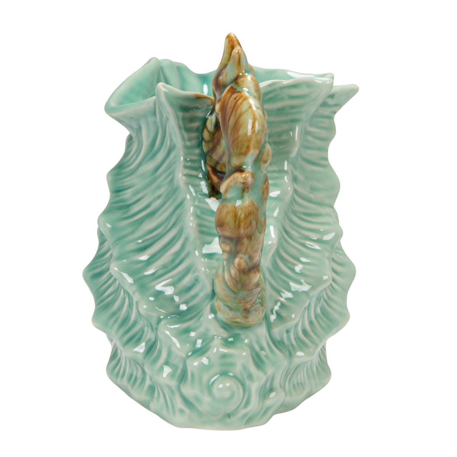Ceramic seahorse figure on a textured green base with wavy patterns