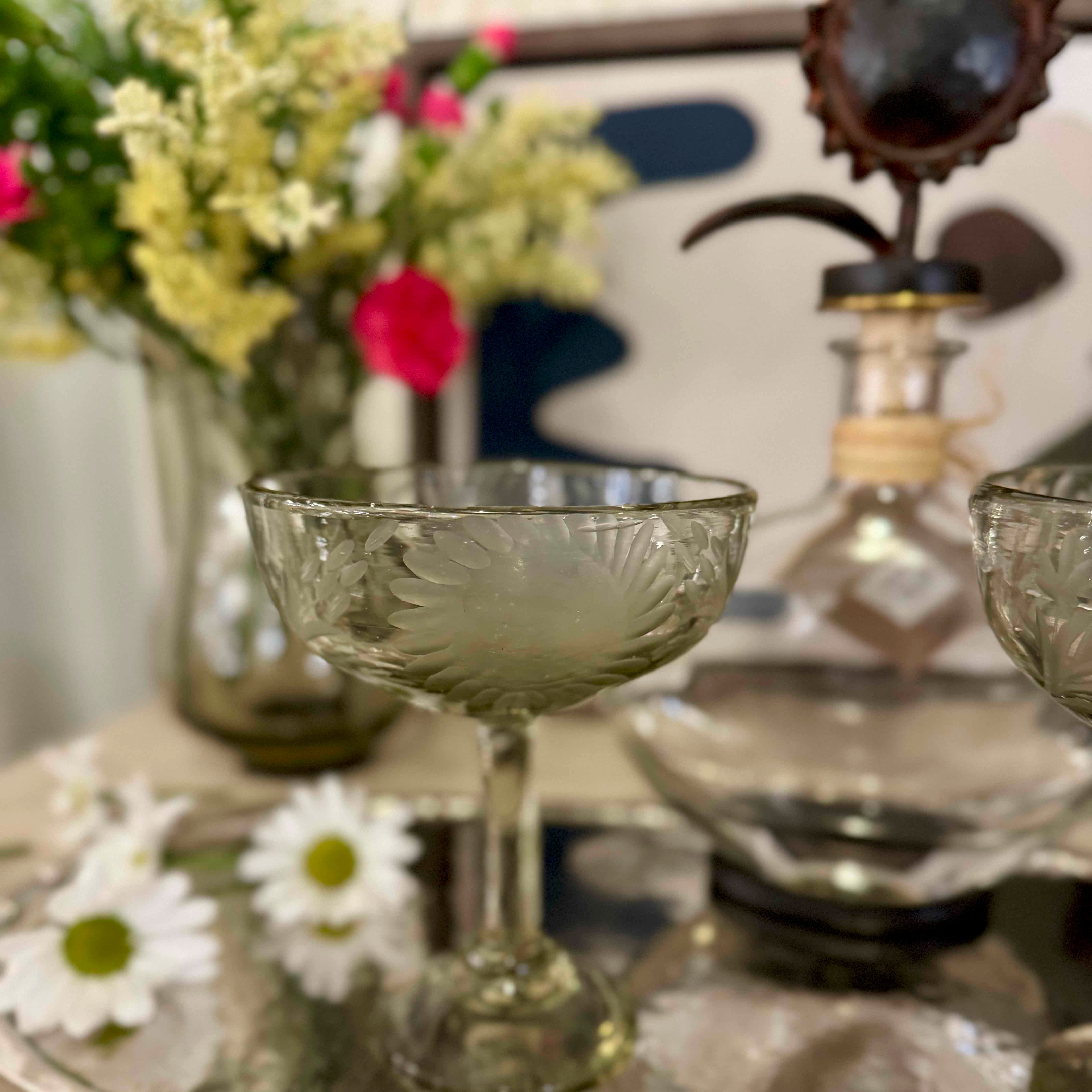 Decorative glassware with floral arrangement on a table