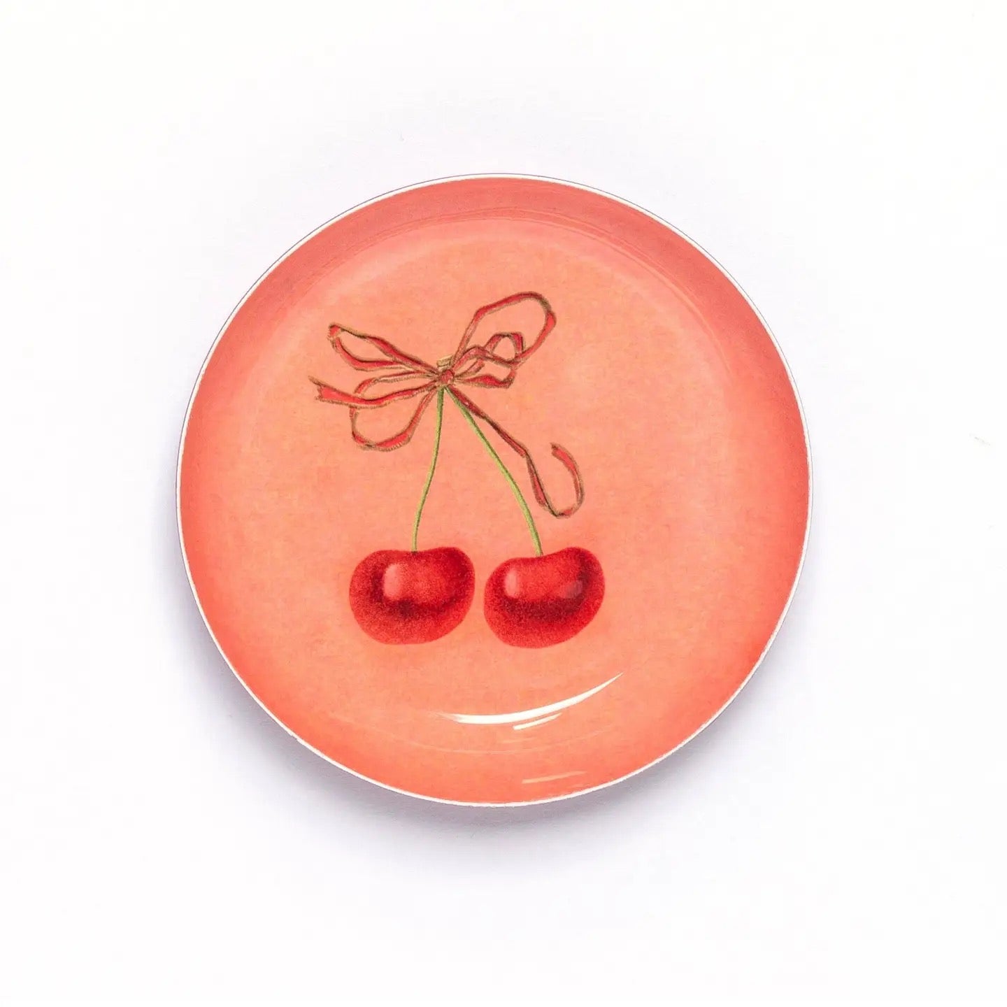 Ceramic plate with cherry design on a white background