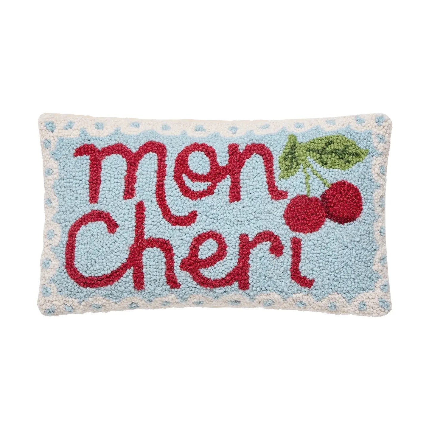 Rectangular pillow with 'mon cheri' text and cherry design on a light blue background