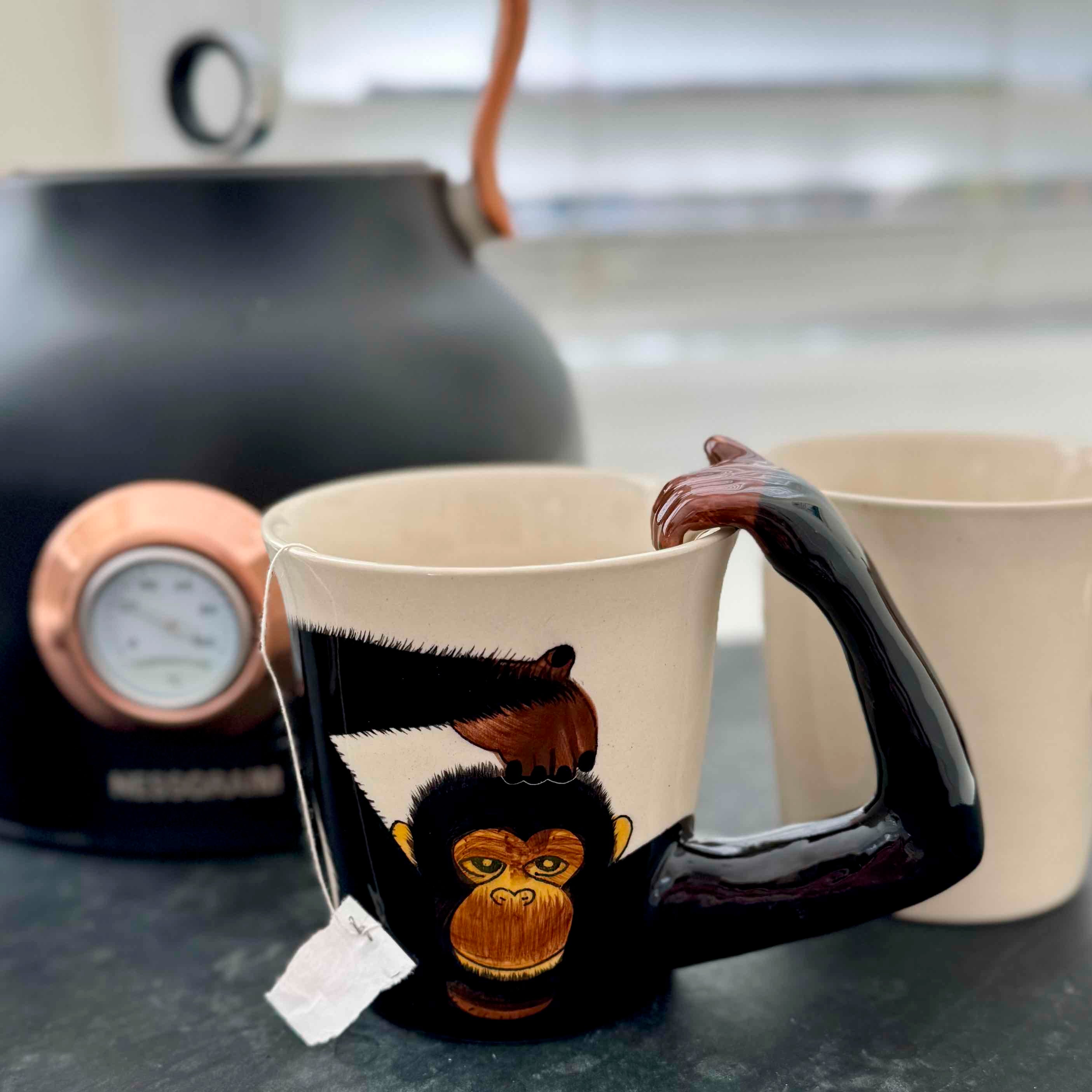 Mug with monkey design on a kitchen counter