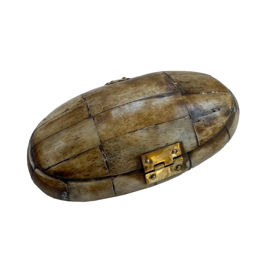 Wooden box with a gold latch on a white background