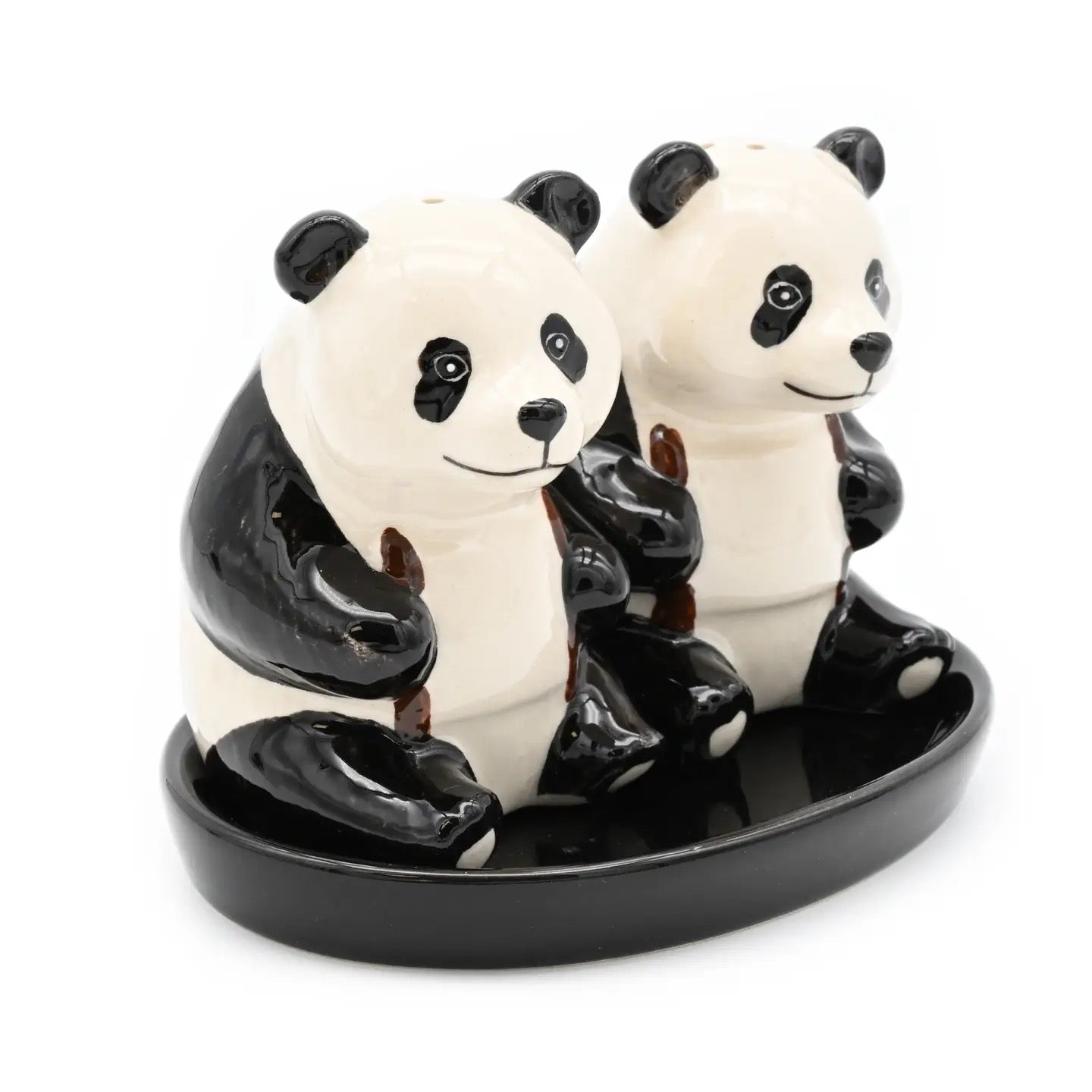 Panda-shaped salt and pepper shakers on a matching tray
