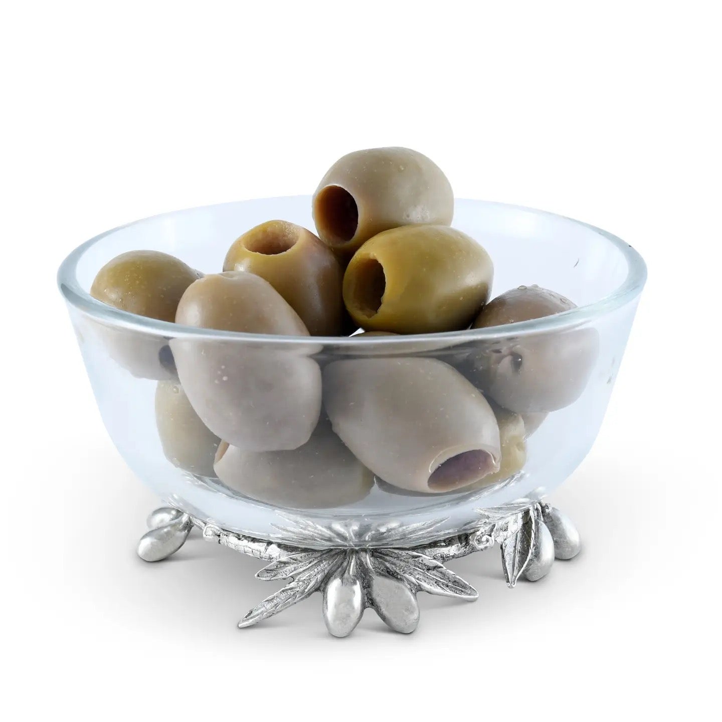 Clear glass bowl with green olives on a white background