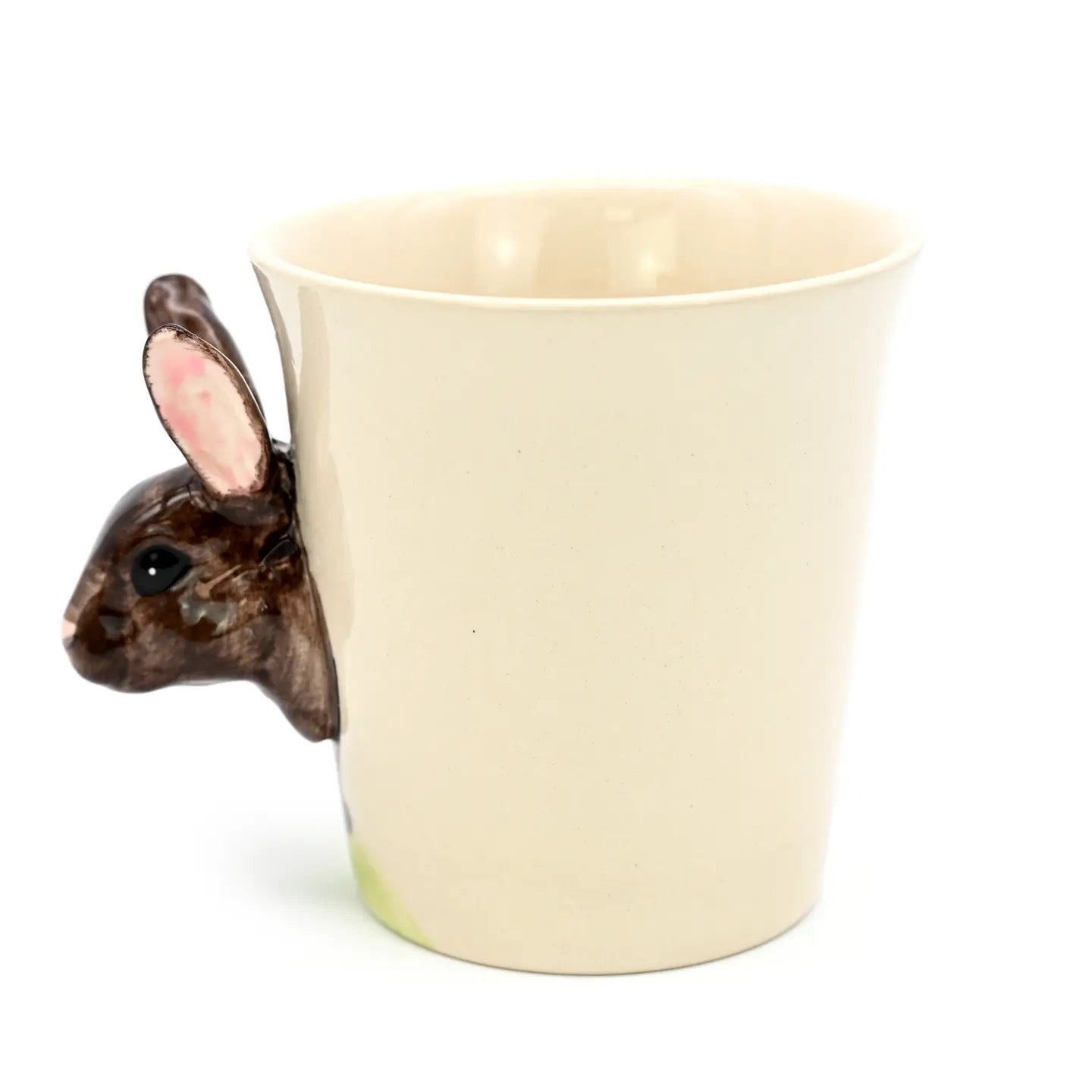 Ceramic mug with a rabbit-shaped handle on a white background