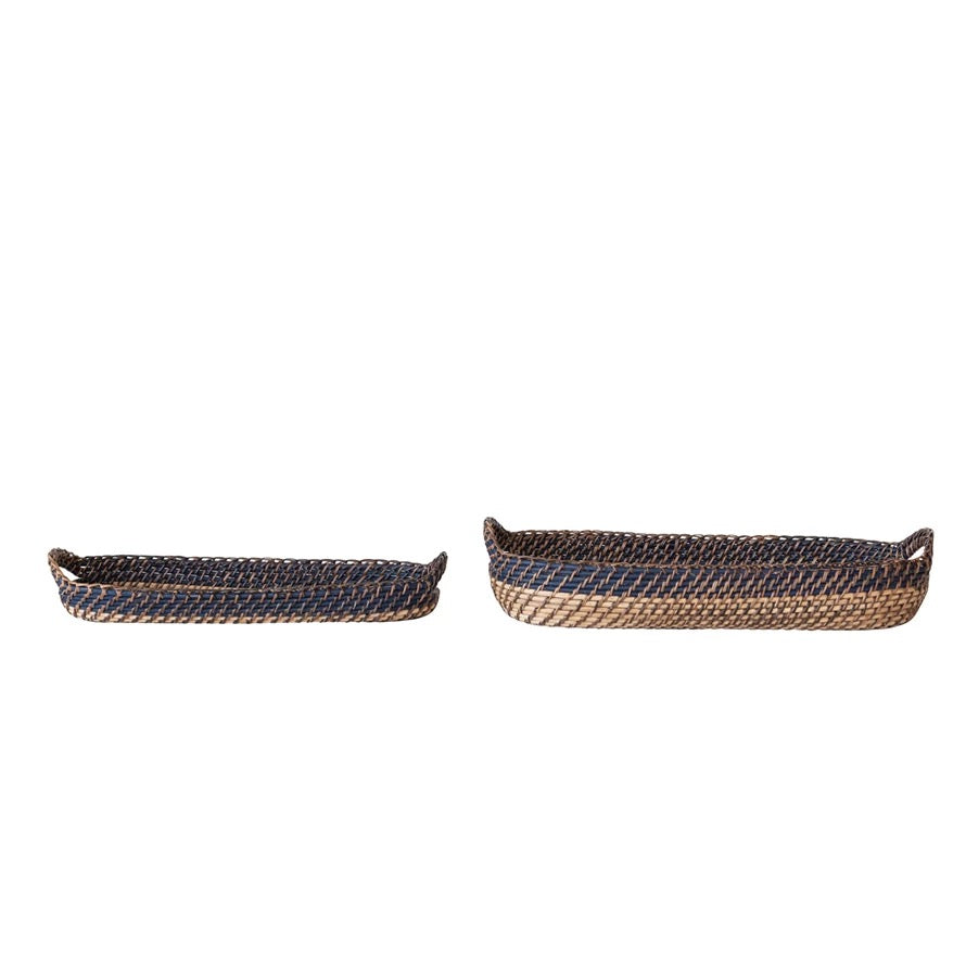 Two woven baskets on a white background