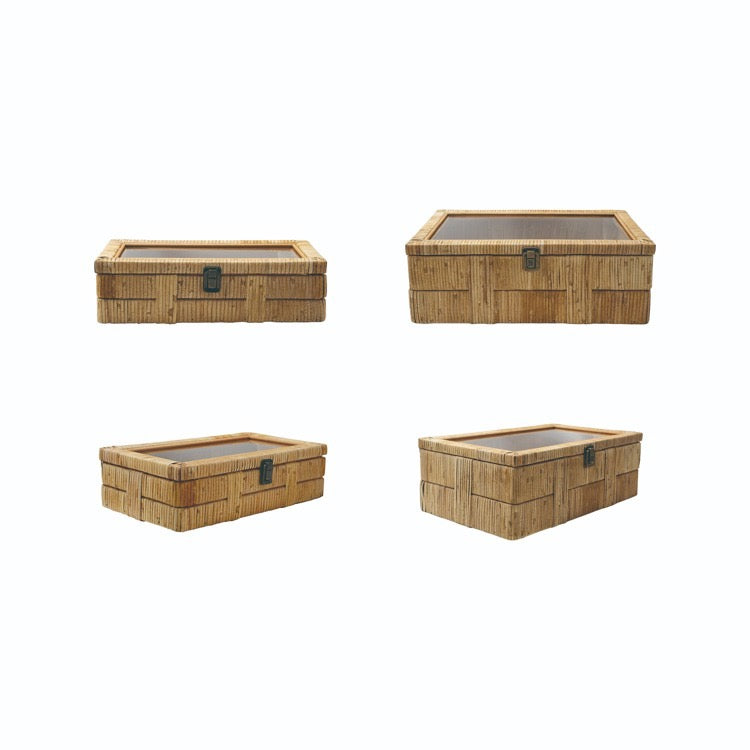 Four woven storage boxes on a white background