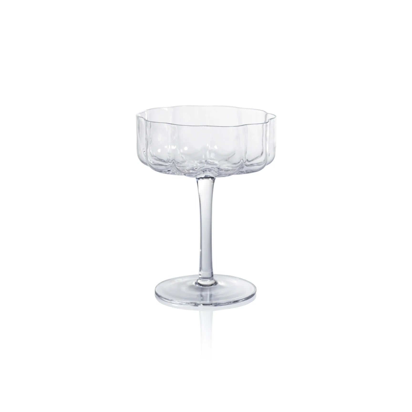 A clear glass coupe or champagne flute with a flared, scalloped rim, a slender stem, and a round base, shown on a plain white background.