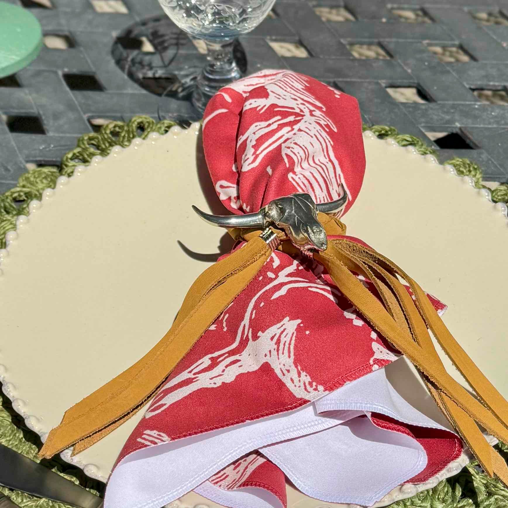Decorative napkin with bull design on a table setting