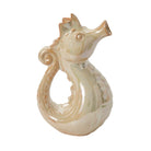 Decorative seahorse figurine on a white background