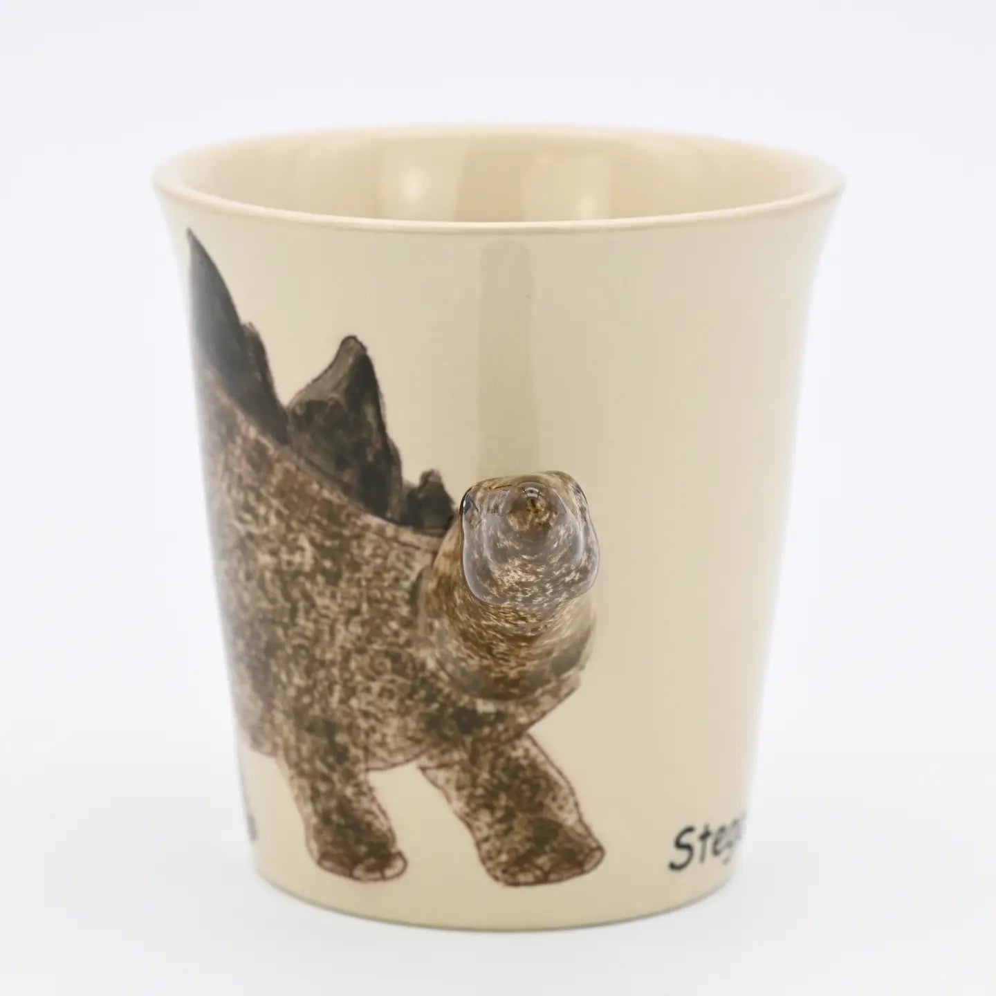 Beige cup with a printed otter design on a white background
