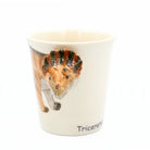 Mug with a triceratops design on a white background