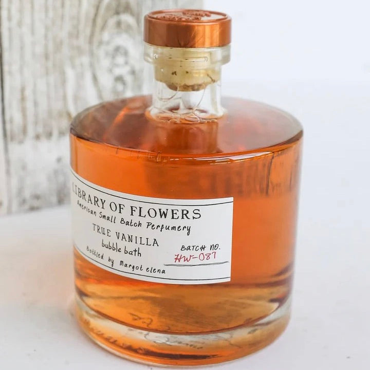 Bottle of 'True Vanilla' bubble bath from 'Library of Flowers' on a light background
