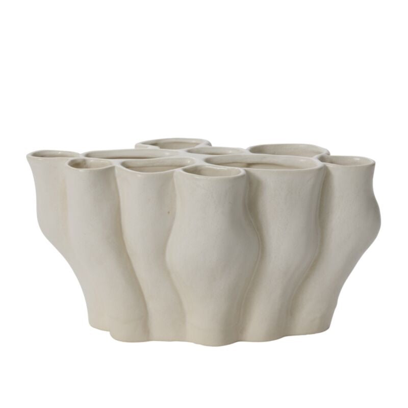 White ceramic vase with a textured, organic design on a white background