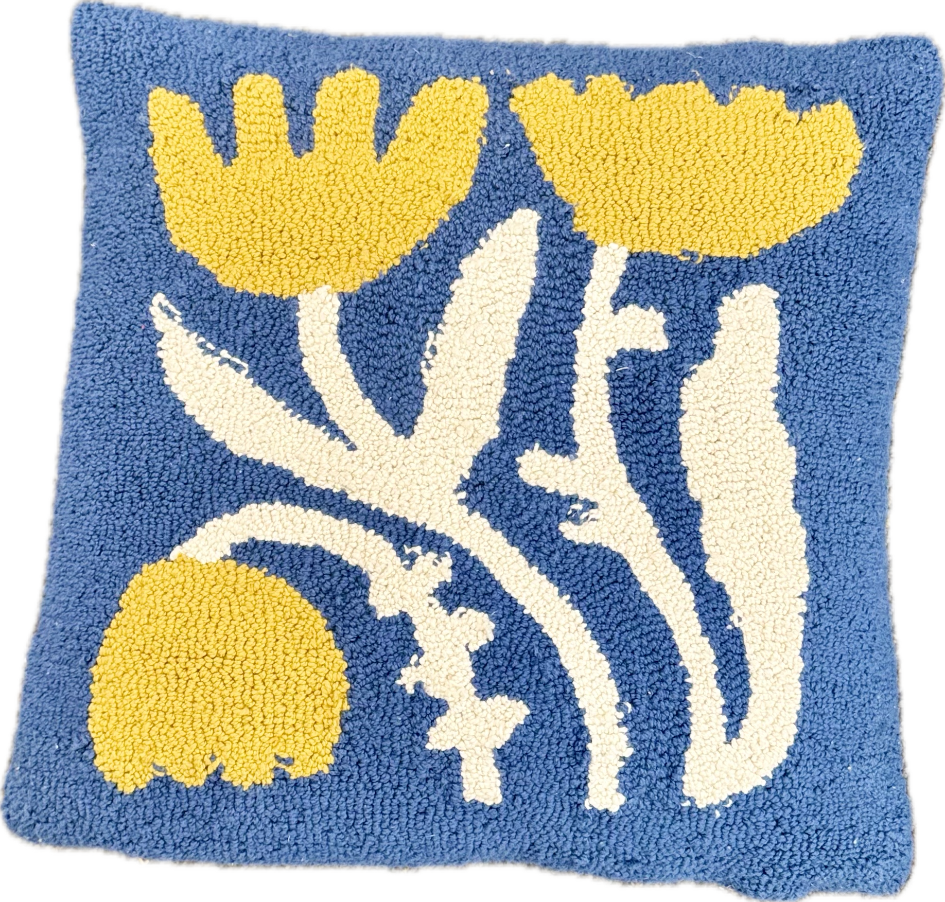 Decorative pillow with floral pattern on a blue background