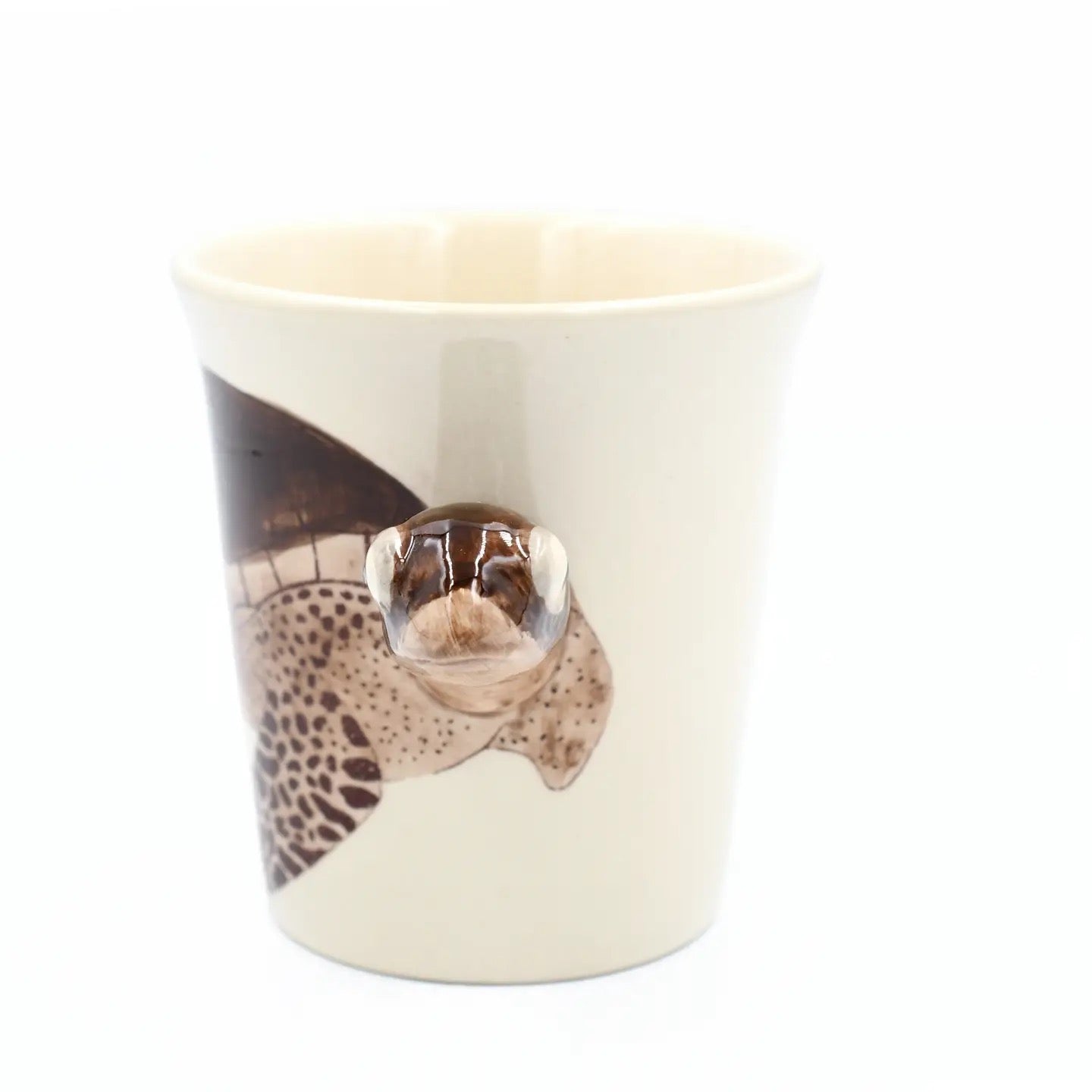 Ceramic mug with a cheetah design on a white background
