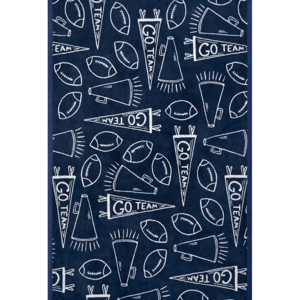 Navy blue towel with white sports-themed pattern including footballs, megaphones, and 'GO TEAM' text.