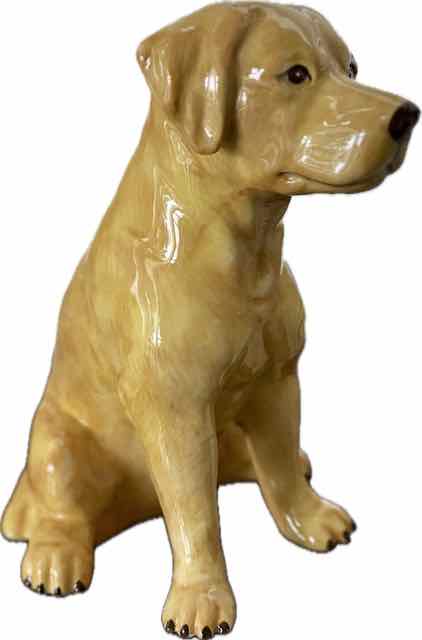 Ceramic dog figurine on a white background