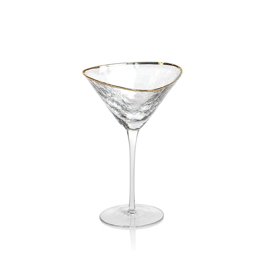An elegant triangular martini glass with a gold rim on a clear glass base.