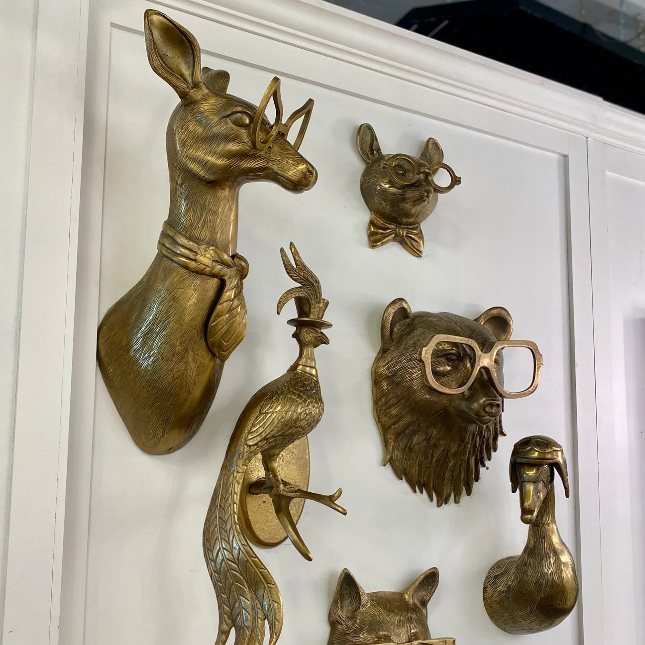 Brass finished metal animal heads