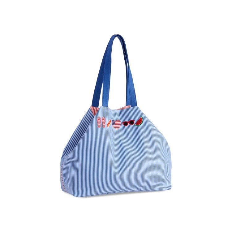 Blue striped tote bag with decorative elements on a white background