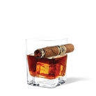 Glass of whiskey with a cigar on a white background