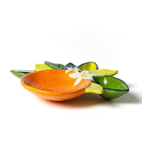 Decorative ceramic leaf-shaped dish with a small bowl on a white background
