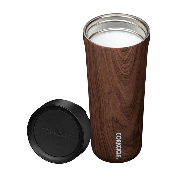 Wooden tumbler with black lid on a white background