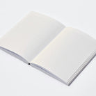 Open notebook with white pages on a light gray background