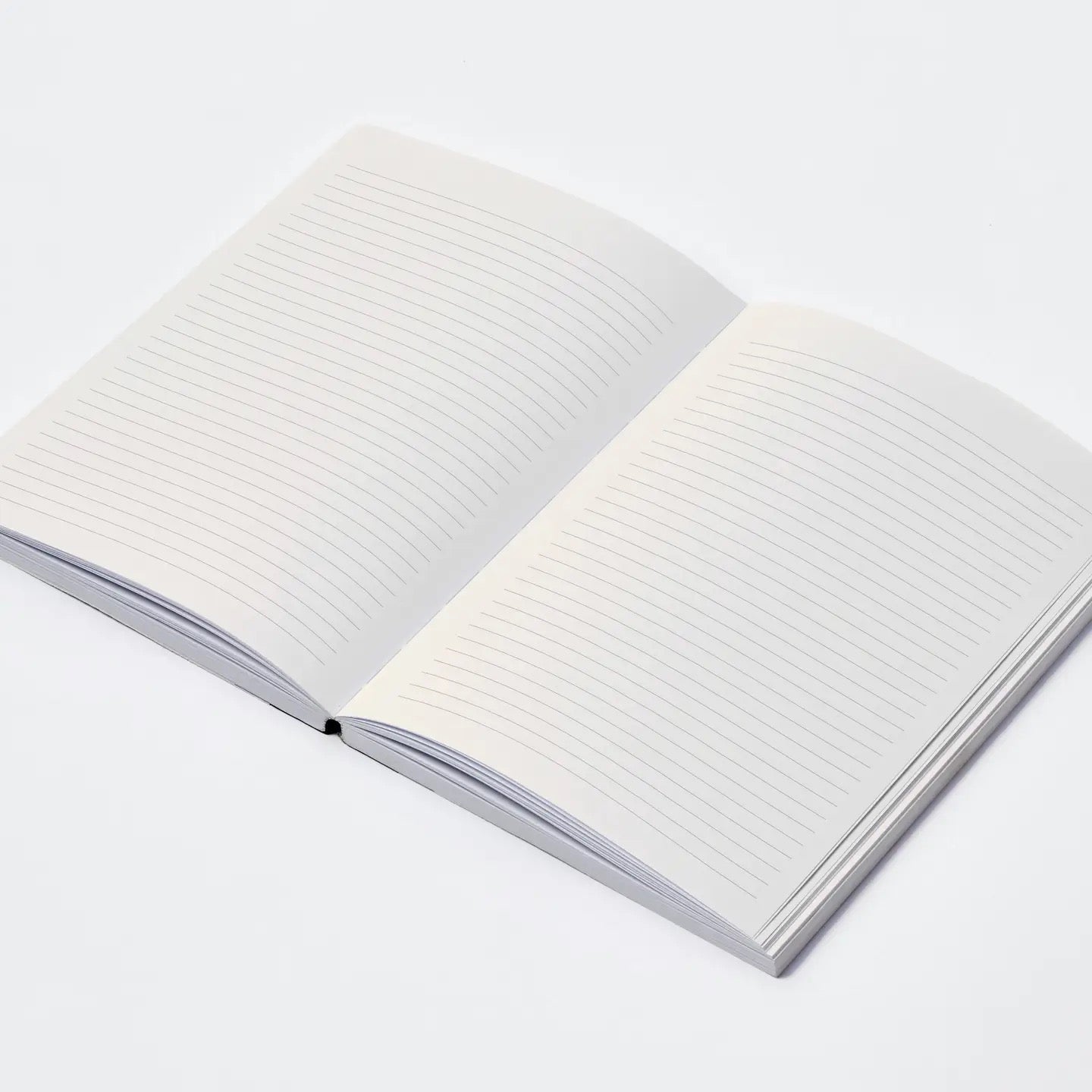 Open notebook with white pages on a light gray background