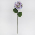 Artificial flower stem with purple and green leaves on a white background