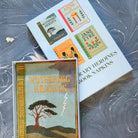 Book-themed napkins with 'Wuthering Heights' design on a metallic surface