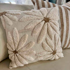 Decorative pillow with floral pattern on a couch