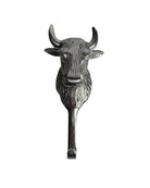 Metallic bull head wall hook on a white background