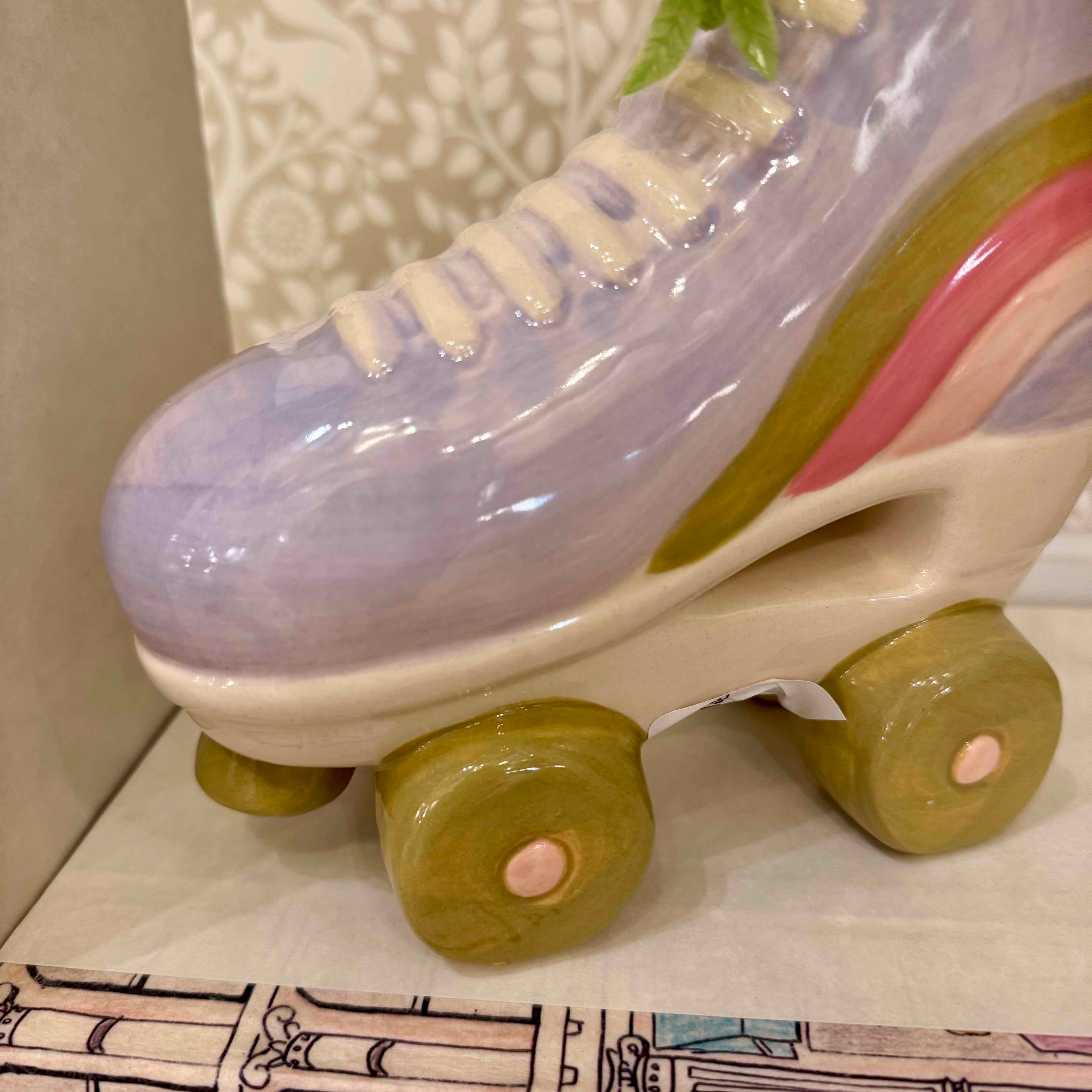 Ceramic roller skate with pastel colors on a decorative surface