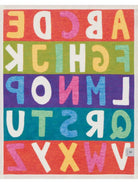 Colorful alphabet rug with letters on a white background