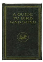 Book titled 'A Guide to Bird Watching' with a green cover and gold text.