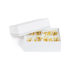 White hairband with yellow floral design on a white background