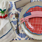 Table setting with red, white, and blue theme including a plate with an American flag design.