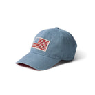 Blue denim cap with an American flag patch on a white background