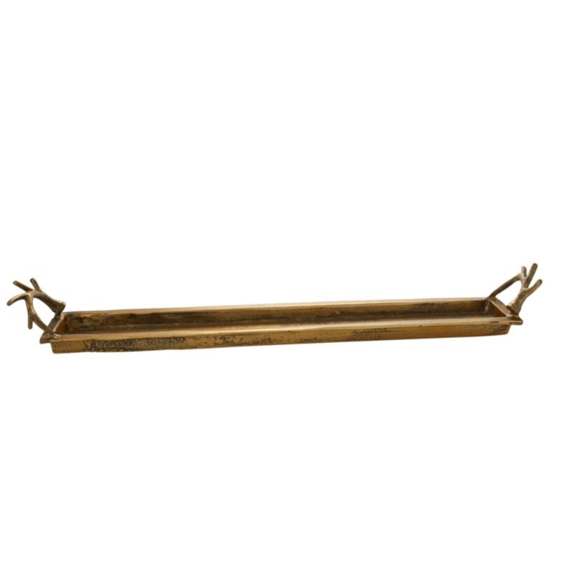 Long, narrow brass tray with decorative ends on a white background