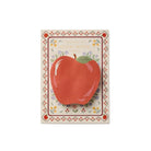 Notepad with a red apple illustration on a decorative border