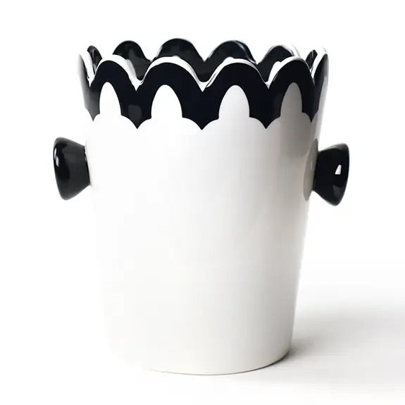 White vase with black wavy rim and handles on a white background